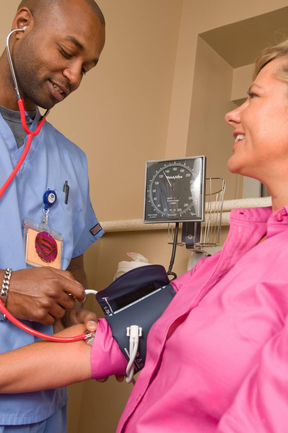 Doctor checking a patient's blood pressure